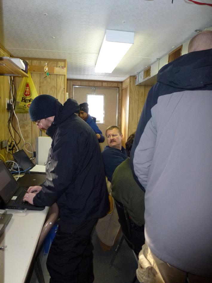Scientists inside the cramped GCPex operations trailer
