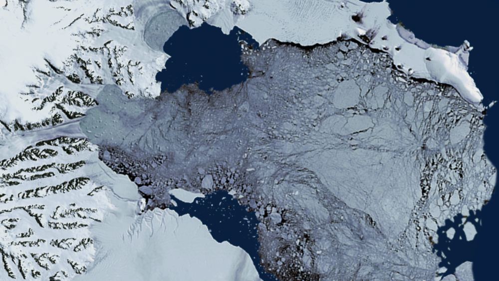 Still of the Larsen-B ice shelf collapse on December 8, 2002, as shown by Landsat-7. 