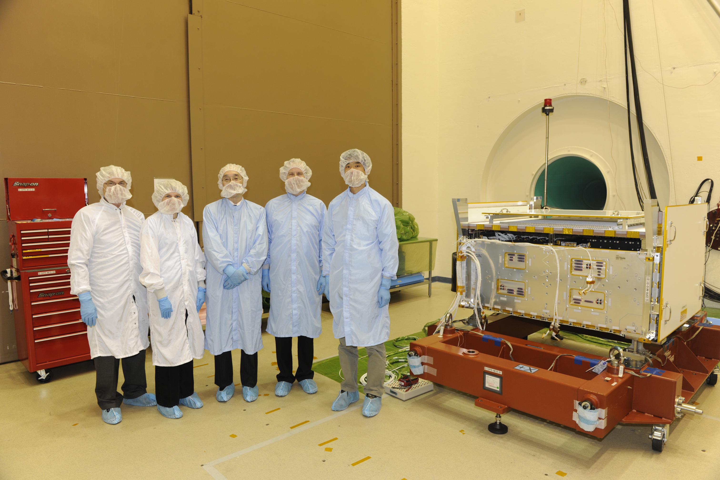 NASA and JAXA scientists in front of the DPR