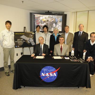 NASA and JAXA officials at the DPR signing event