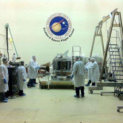 Scientists stand around the GMI which just arrived at NASA Goddard